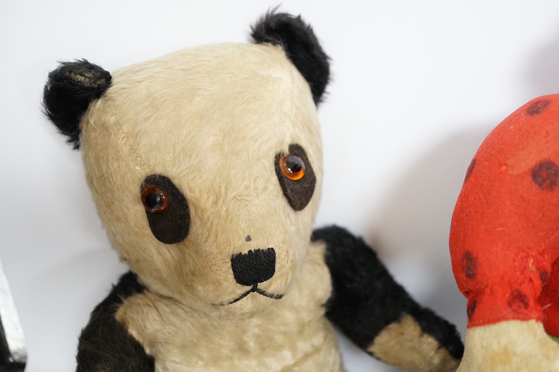 A Katzenjammer Kids 'Misses', felt body and composition face, 36cm high, a Chiltern panda, 1950's, and a Merrythought bull, 1950's (hair loss)